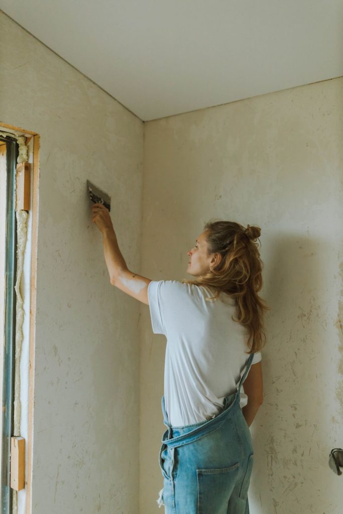 Testing a corner of removable wallpaper to check for paint damage