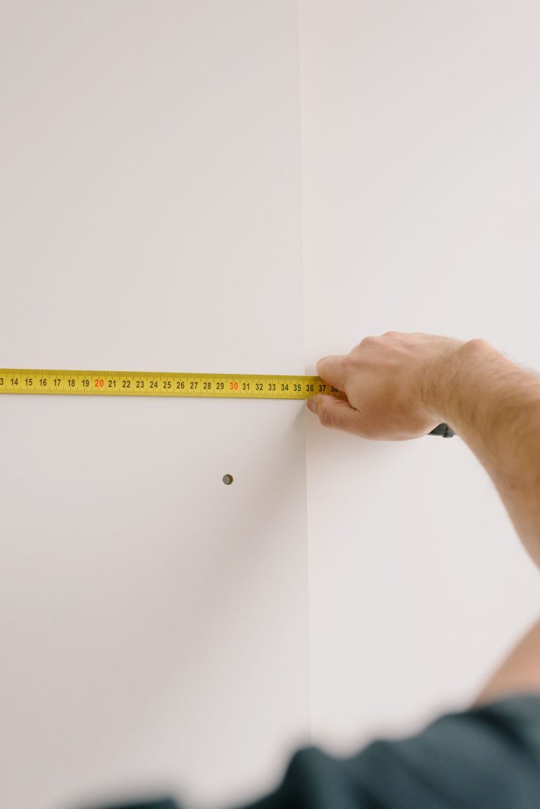 Measuring the height of a framed picture hung above a sofa