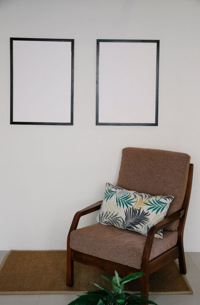 Side view showing the 8 to 10 inch gap between a sofa back and a framed picture